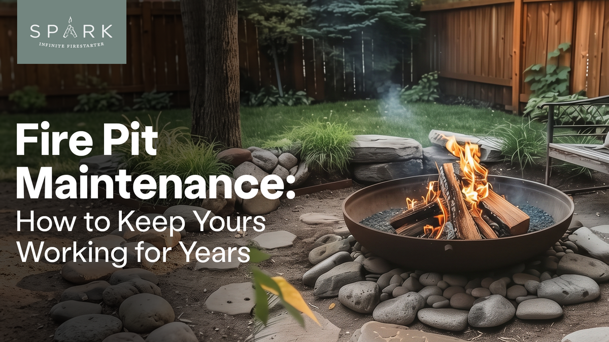 Burning logs in a round steel fire pit surrounded by river rocks in a fenced backyard